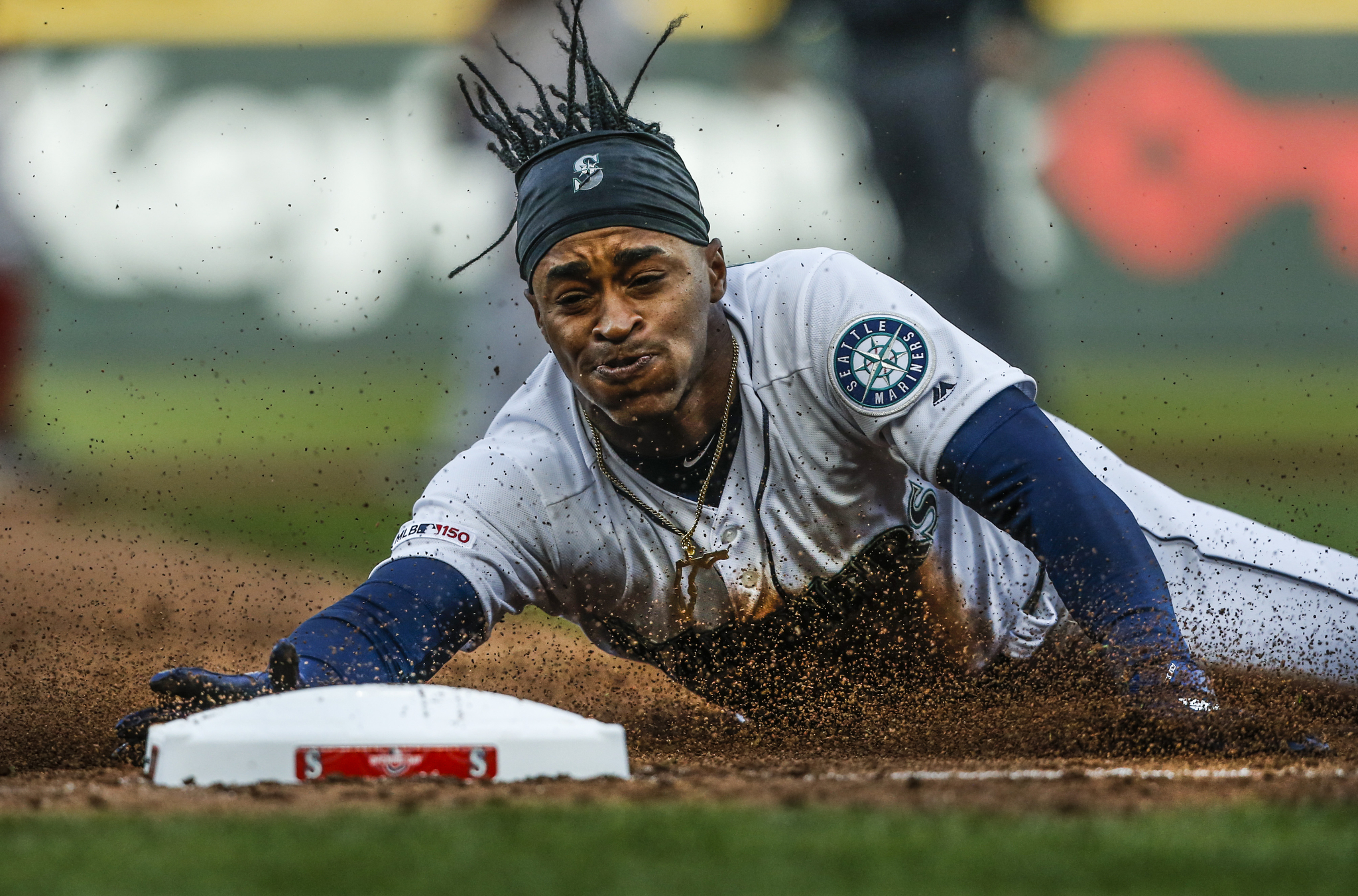  Mariners’ Mallex Smith slides into third base during the Opening Day game against the Boston Red Sox at T-Mobile Park on Thursday, March 28, 2019 in Seattle, Washington. 