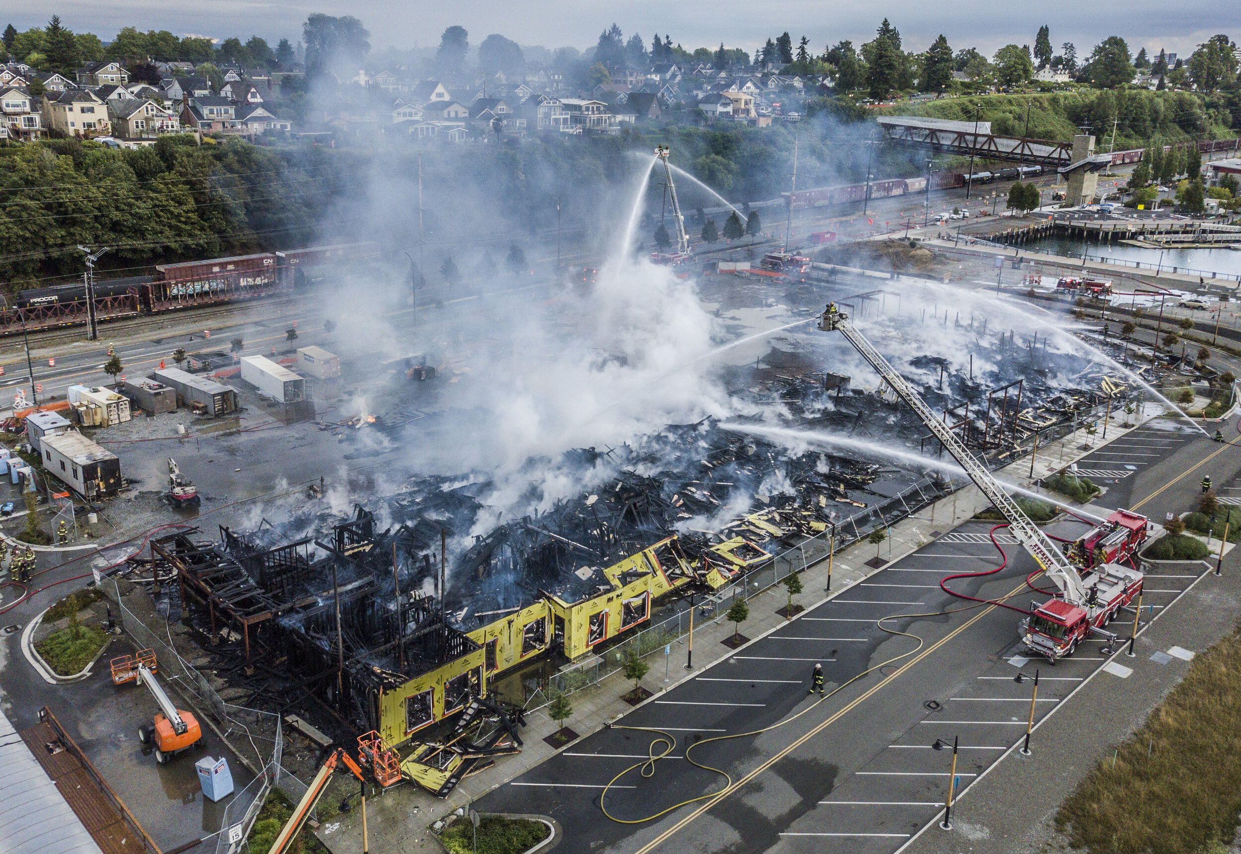  On Friday, July 17, a massive fire destroyed the south portion of the Waterfront Apartments that were under construction at the Port of Everett. Authorities sifted through the rubble and eventually determined the fire was not caused by criminal acti