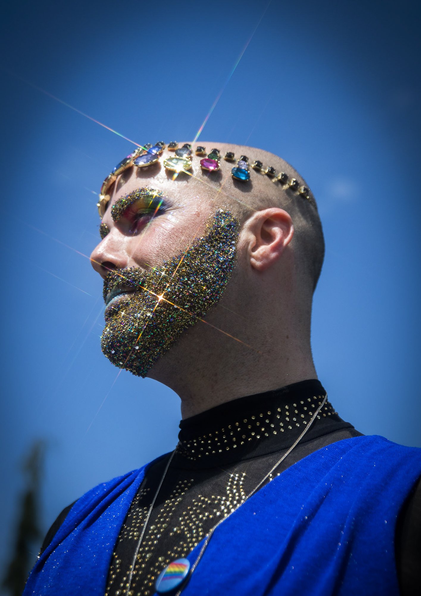  Gina Touche’s glitter beard and jewels shine in the sunlight at Arlington’s first-ever Pride celebration on Saturday, June 4, 2022. An estimated 300 people attended Arlington’s first-ever Pride celebration, and an estimated 800 turned out for a simi