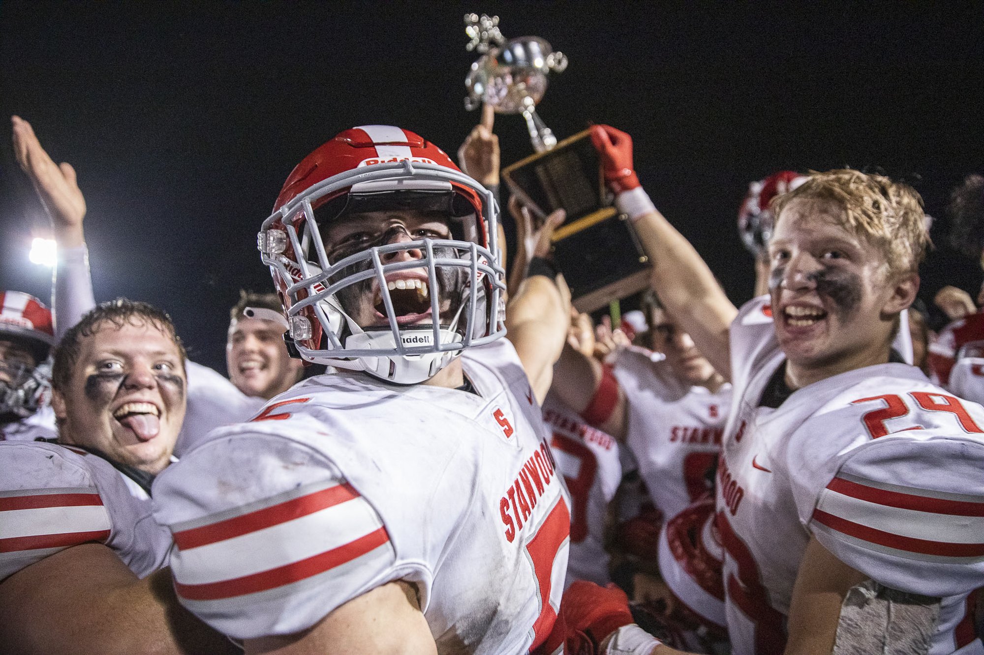  Stanwood’s Ryan Bumgarner and teammates yell in celebration after winning the Stilly Cup for the first time in 11 years on Friday, Sept. 30, 2022 in Arlington, Washington.  