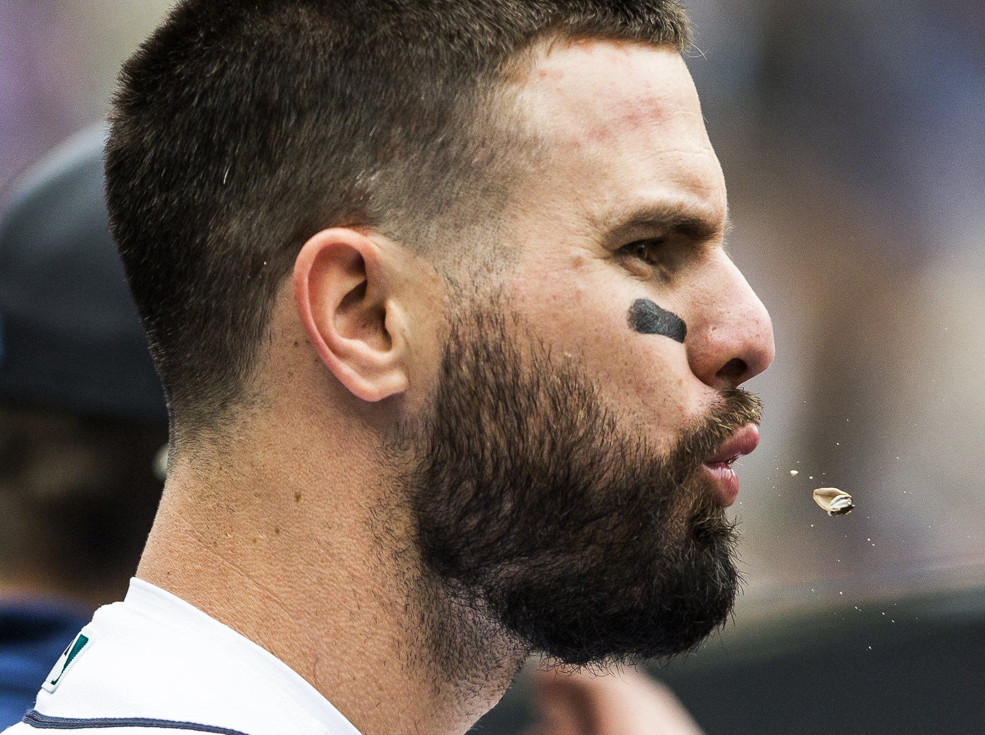  Mariners’ Jesse Winker spits out sunflower seed in the dugout during the game against the Angels on June 19, 2022 in Seattle, Washington.  