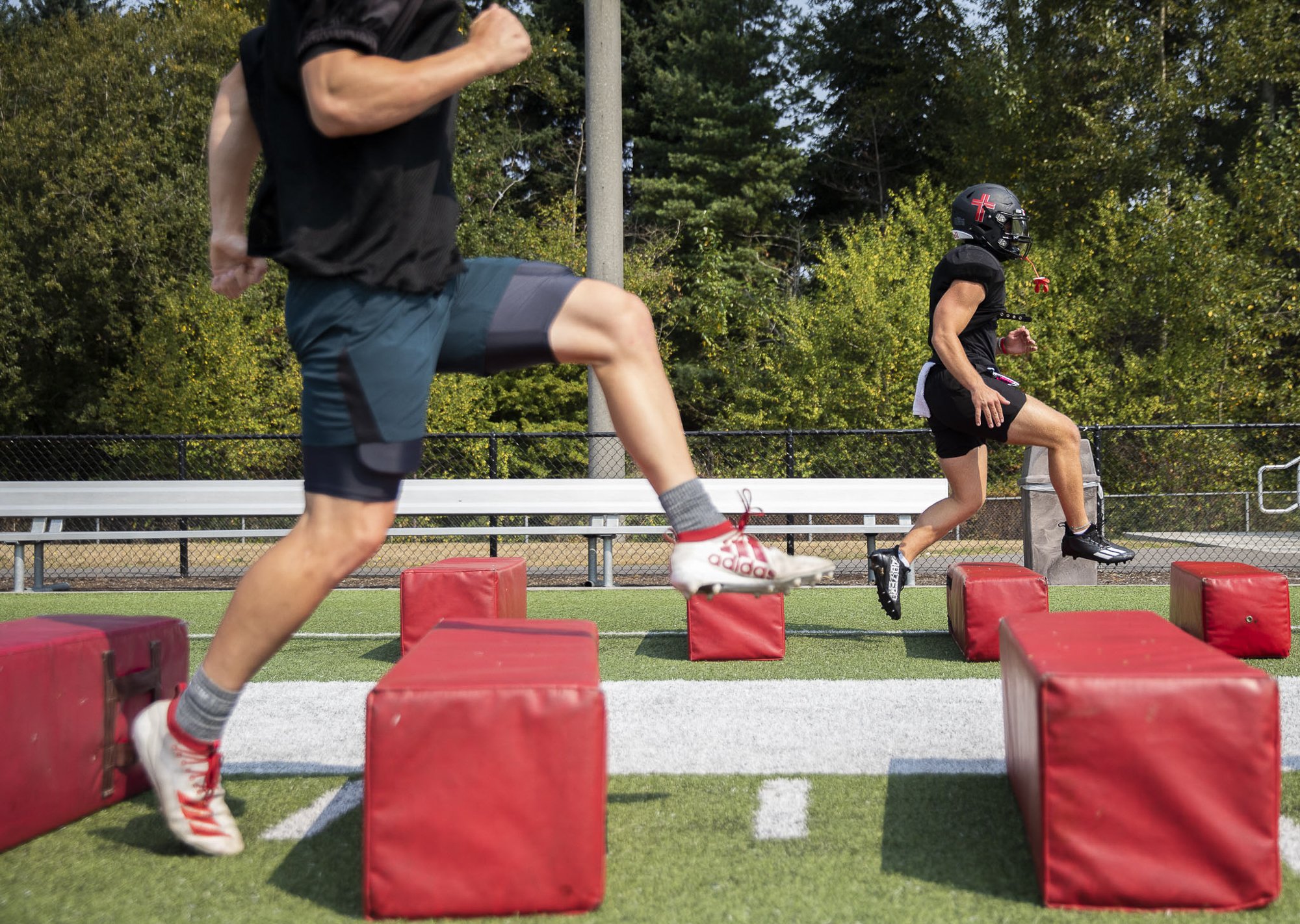  Archbishop Murphy football players run through warm ups during practice on Aug. 24, 2023 in Everett, Washington. 