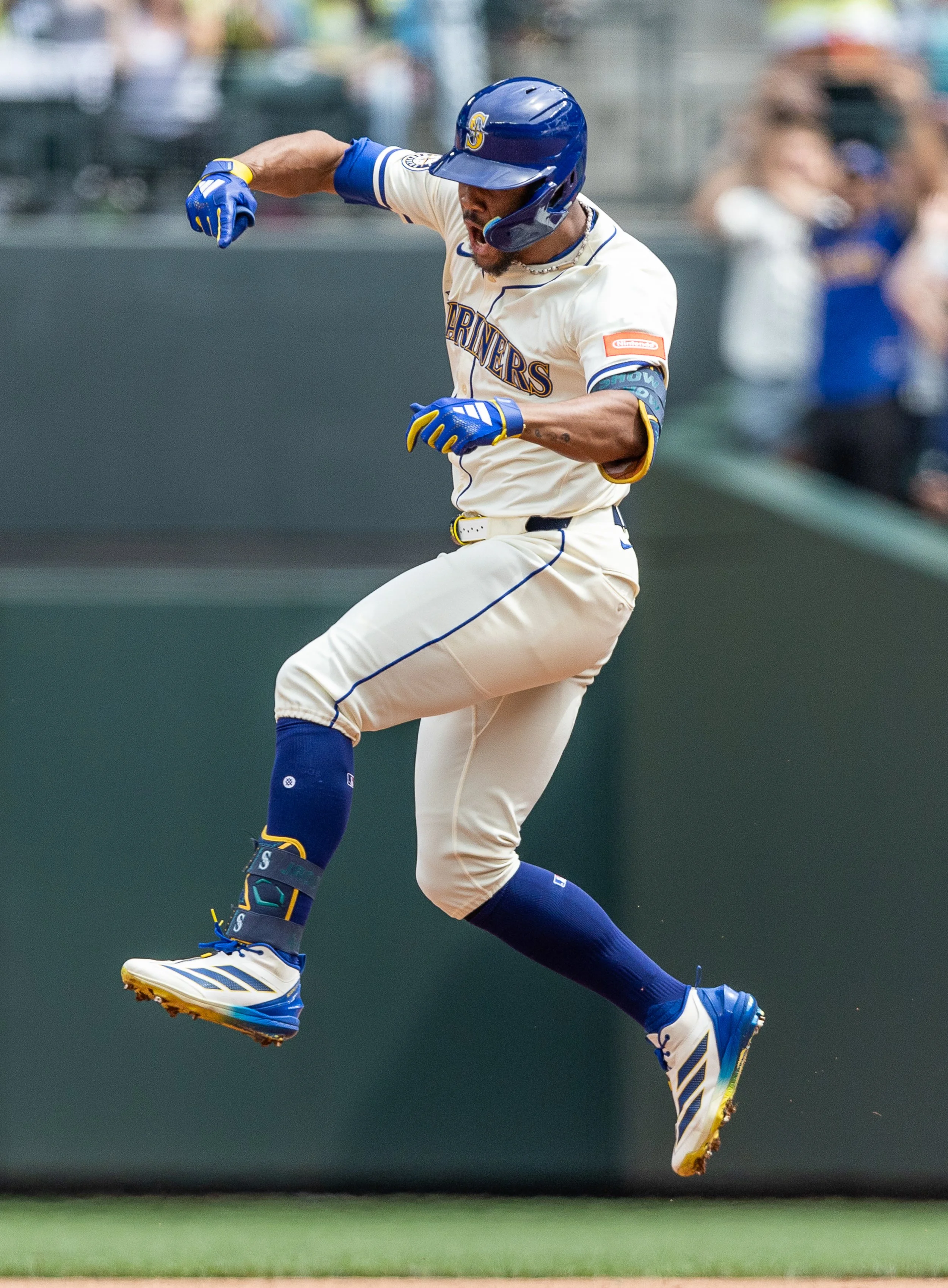  Julio Rodríguez #44 of the Seattle Mariners jumps in the air while running the bases after hitting his 100th career home run giving him a historic 4th straight 20-20 season during the third inning against the Texas Rangers at T-Mobile Park on August