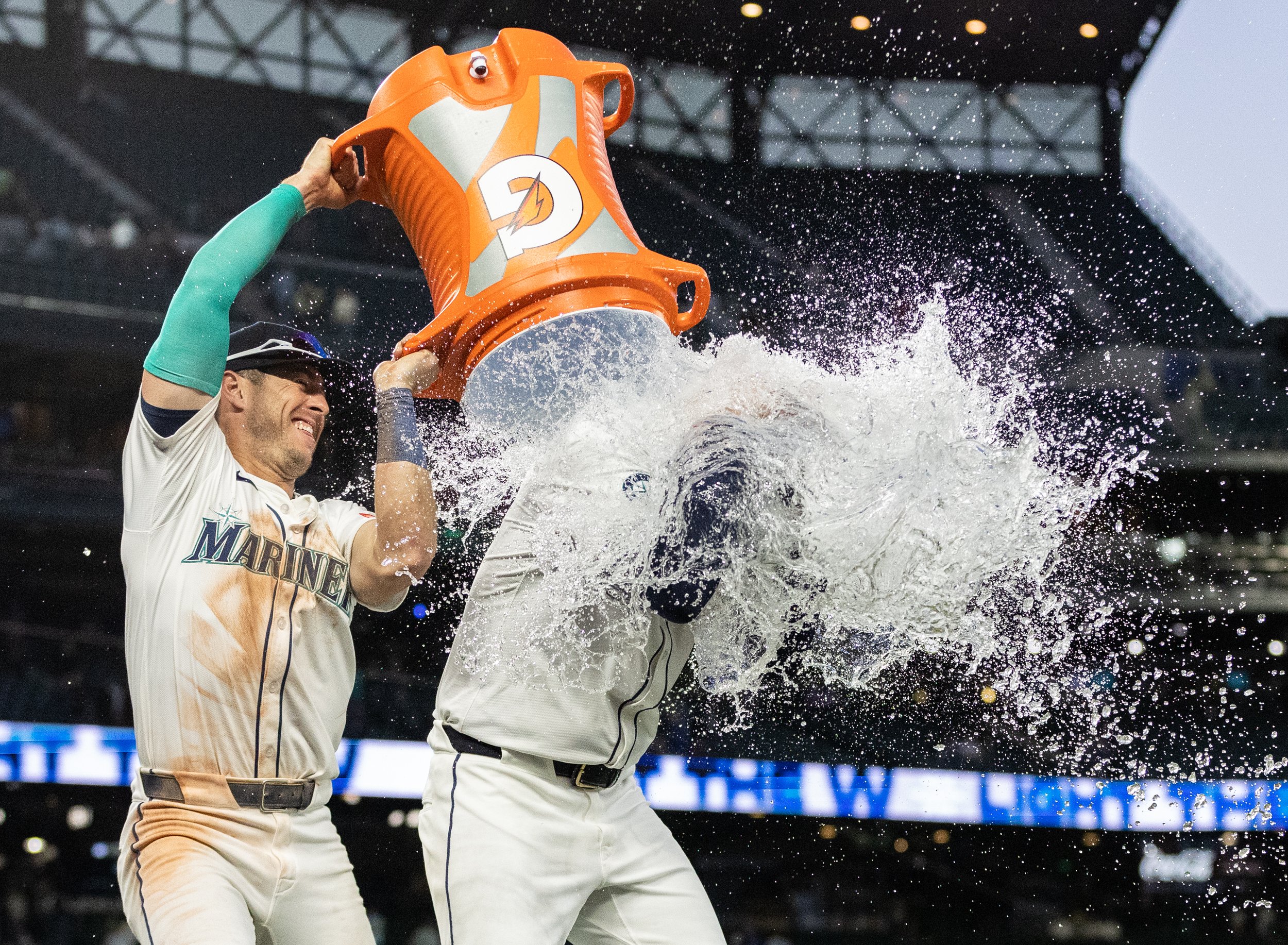  Dylan Moore&nbsp;#25 of the Seattle Mariners dumps water on teammate Logan Evans&nbsp;#73 after beating the Washington Nationals at T-Mobile Park on May 27, 2025 in Seattle, Washington. (Olivia Vanni / Getty Images) 