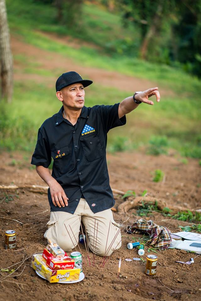 Ron Reyes points to the area where his father was killed on a hill overlooking Khe Sanh. Every trip participant from the U.S. was able to visit the site where his or her father died, and to hold a service. 