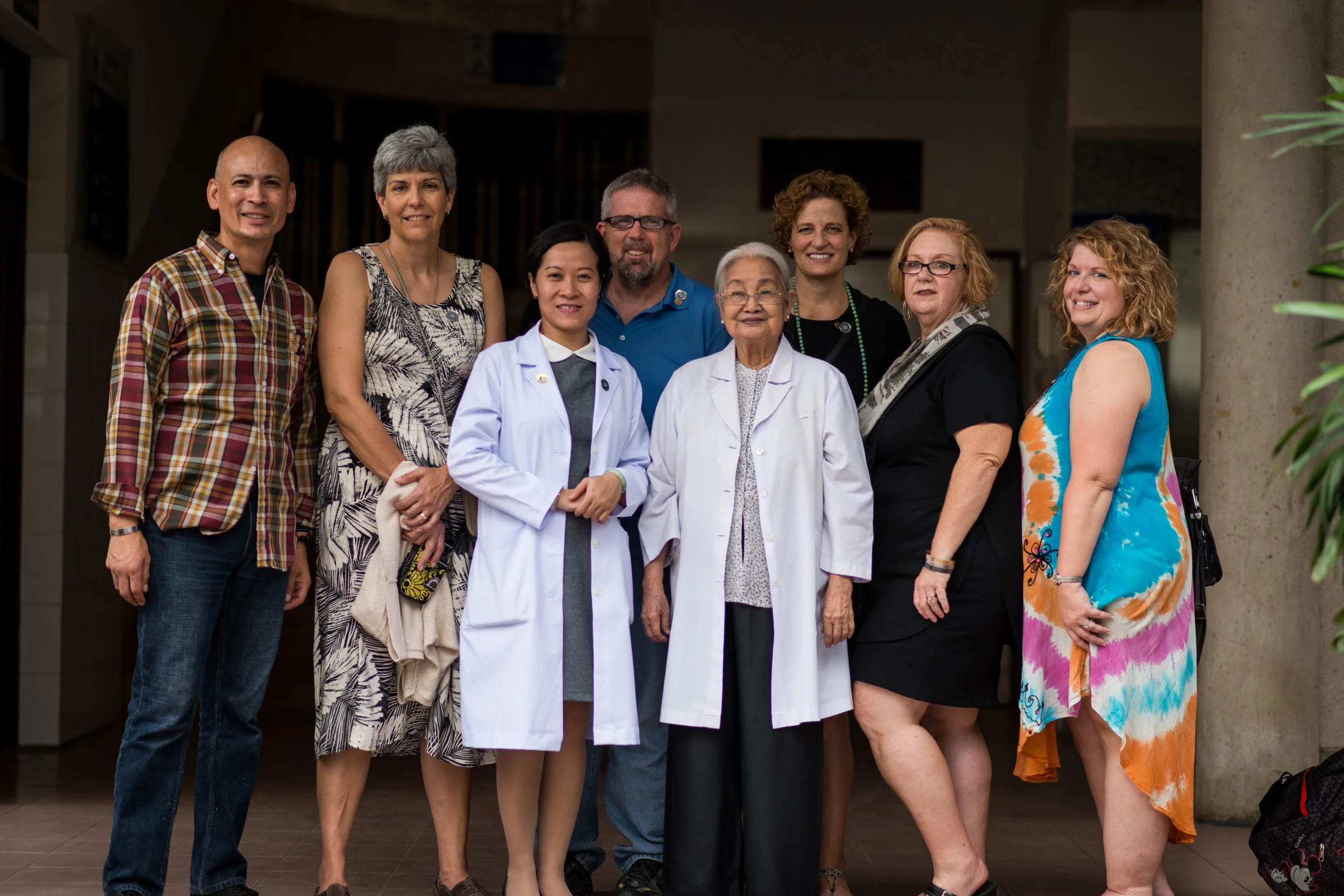 The 2 Sides Project group with the current director and the director emeritus of the Peace Village. Photo courtesy Istrico Productions/2 Sides Project. 
