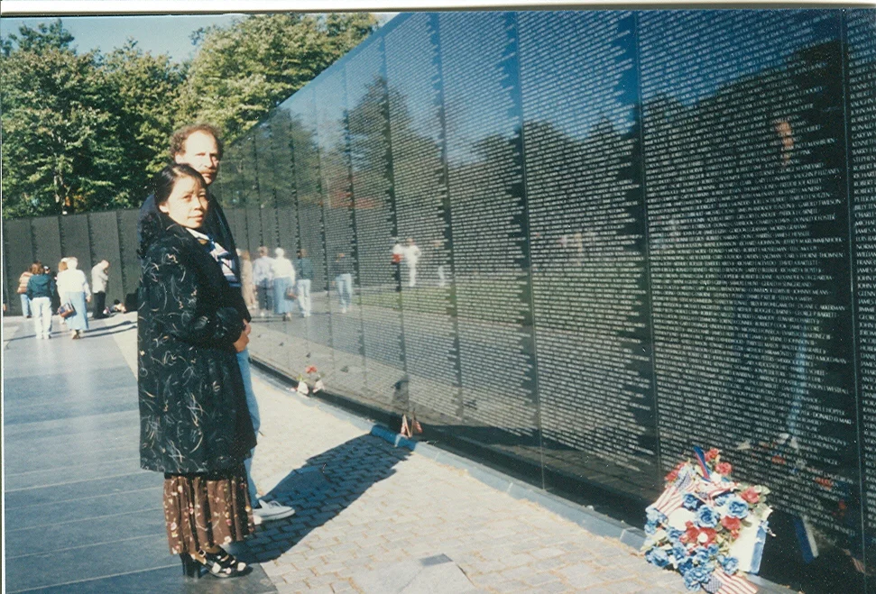 Wayne Karlin and Le Minh Khue at the Vietnam Veterans Memorial Wall in Washington, D.C., 1993.
Normal
0
false
false
false
EN-US
JA
X-NONE
/* Style Definitions */
table.MsoNormalTable
{mso-style-name:"Table Normal";
mso-tstyle-rowband-size:0;
mso-tstyle-colband-size:0;
mso-style-noshow:yes;
mso-style-priority:99;
mso-style-parent:"";
mso-padding-alt:0in 5.4pt 0in 5.4pt;
mso-para-margin:0in;
mso-para-margin-bottom:.0001pt;
mso-pagination:widow-orphan;
font-size:12.0pt;
font-family:"Avenir Book";
color:#2A2F3C;}
Wayne Karlin và Lê Minh Khuê tại bức tường tưởng niệm cựu chiến binh chiến tranh Việt Nam, ở Washington D.C., 1993