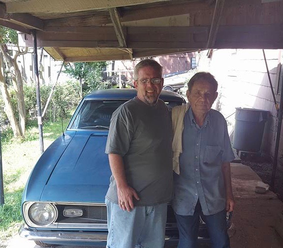 Mike with Grandpa Burkett and the Camaro.