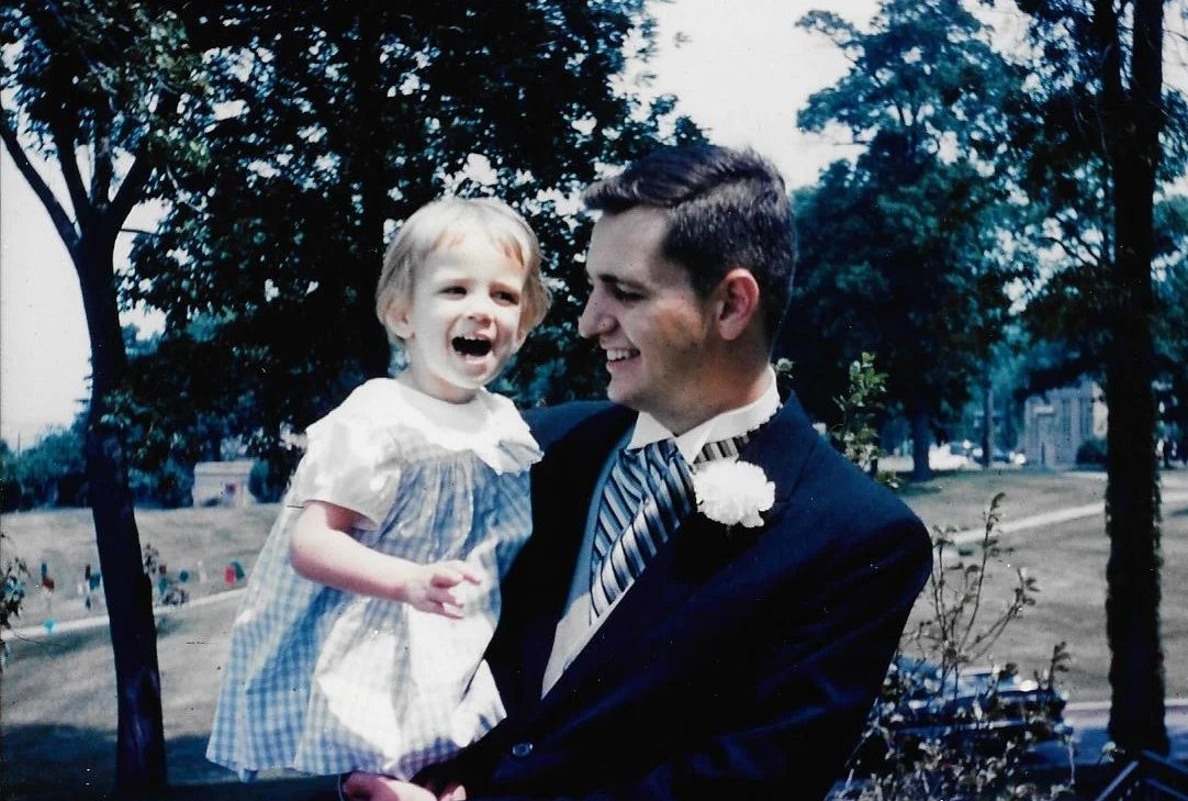 Kim and her father at a family wedding in 1964