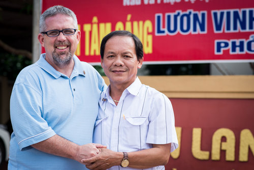 Mike Burkett with Ho Tuan Nghia after the 2 Sides Project meeting in Quang Tri. Both men share the experience of losing their father in war. They also share a love of photography.