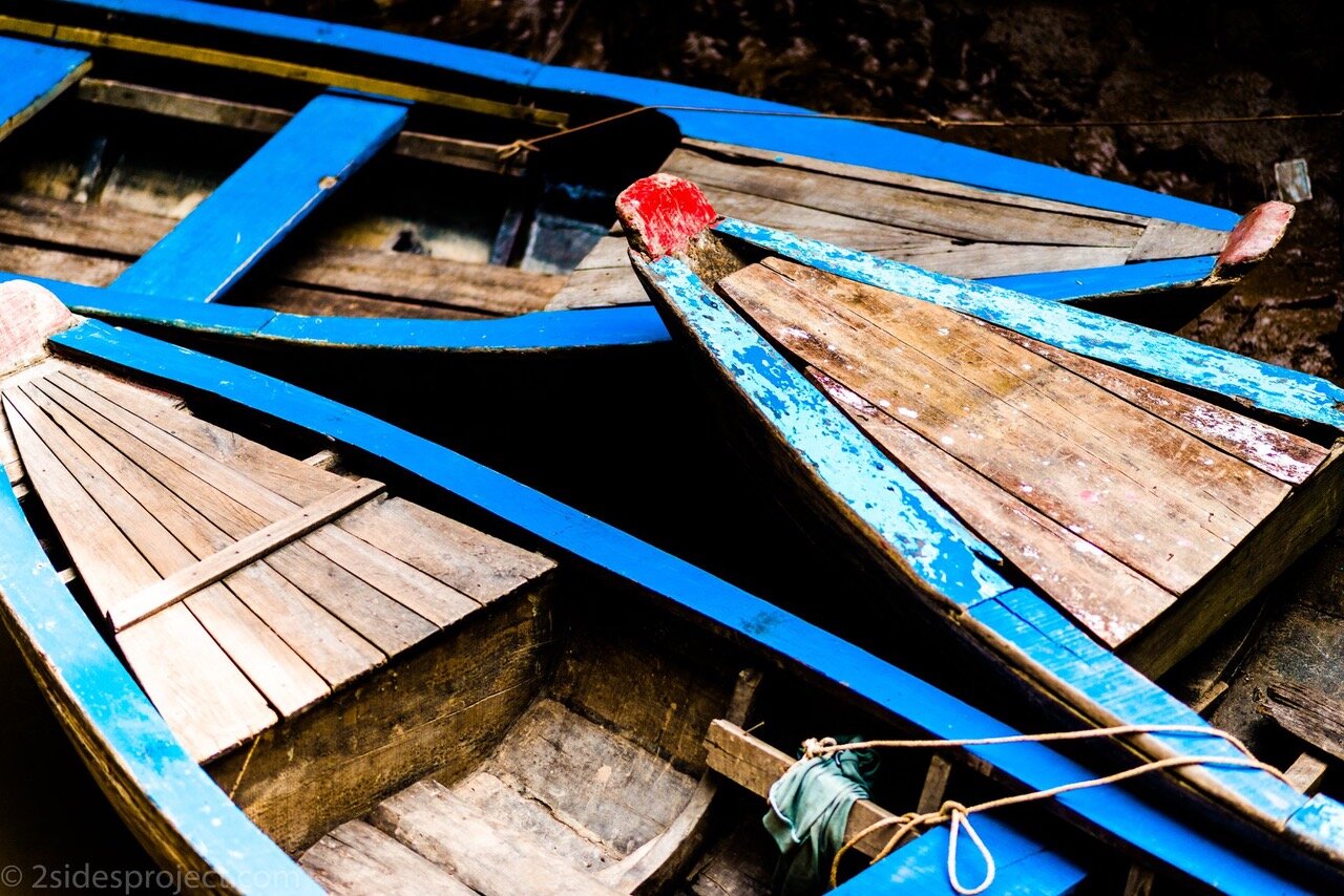 Photographs from the 2 Sides Project trips to Vietnam: Blue Lines, by Anthony Istrico “We had traveled in these little rowboats down a very narrow stream of the Mekong River. I looked down from the docks and saw the most beautiful shades of blue. The colors just jumped out at me. This ended up being one of my absolute favorite shots from a composition perspective. The lines just seem to cut across the frame.” Blue Lines and more stunning photographs from Vietnam are available in any size (and purchases benefit the 2 Sides Project!) at https://bit.ly/2SwXK4n .