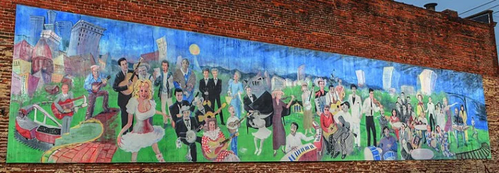 The Knoxville Music History Mural Located 116 East Jackson in the Old City, the music history mural was first completed in 2000 by artist Walt Fieldsa. Fielda restored the mural in 2017.