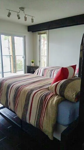 Bedroom 5 | AUTUMN EQUINOX RETREAT | shared accommodations - single bed with optional room divider + direct access to balcony