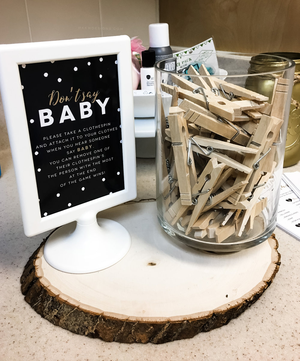 Don't Say Baby game from a coffee baby shower. This game is super easy to set up and a great ice breaker at any shower. // design from shopmkkm.com