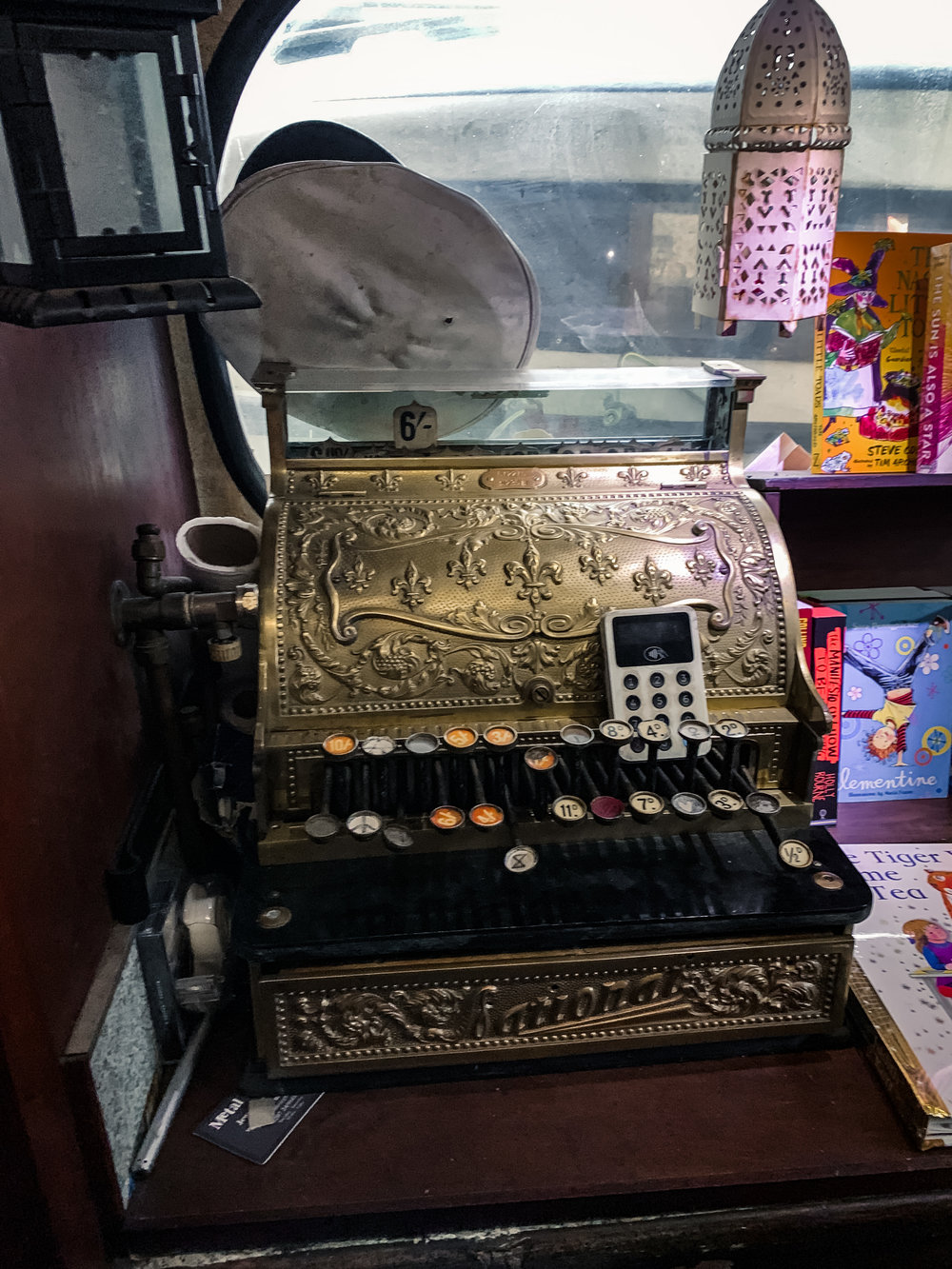 Cash register inside Word on the Water. Check out these 4 can't miss London bookshops on mkkmdesigns.com