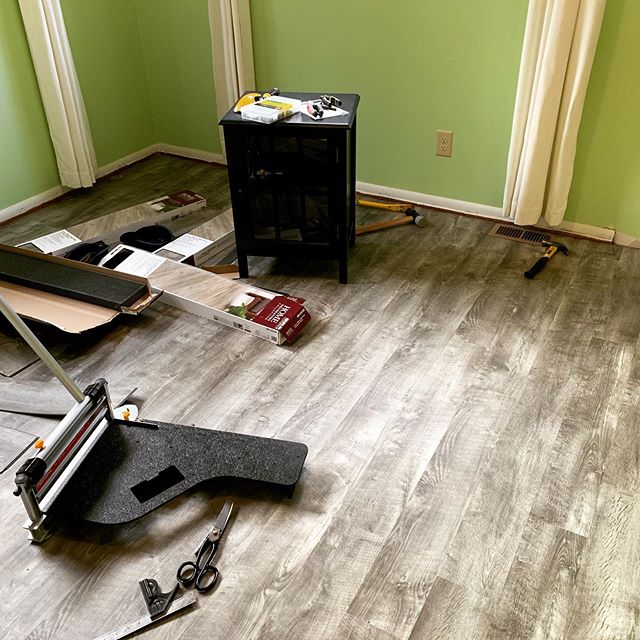 A couple rows left, but not bad for an afternoon. Hoping to get the floor finished and the walls painted tomorrow night. The flooring is Stony Oak Gray luxury vinyl plank from @homedepot . [image of vinyl flooring with tools and loose planks strewn a