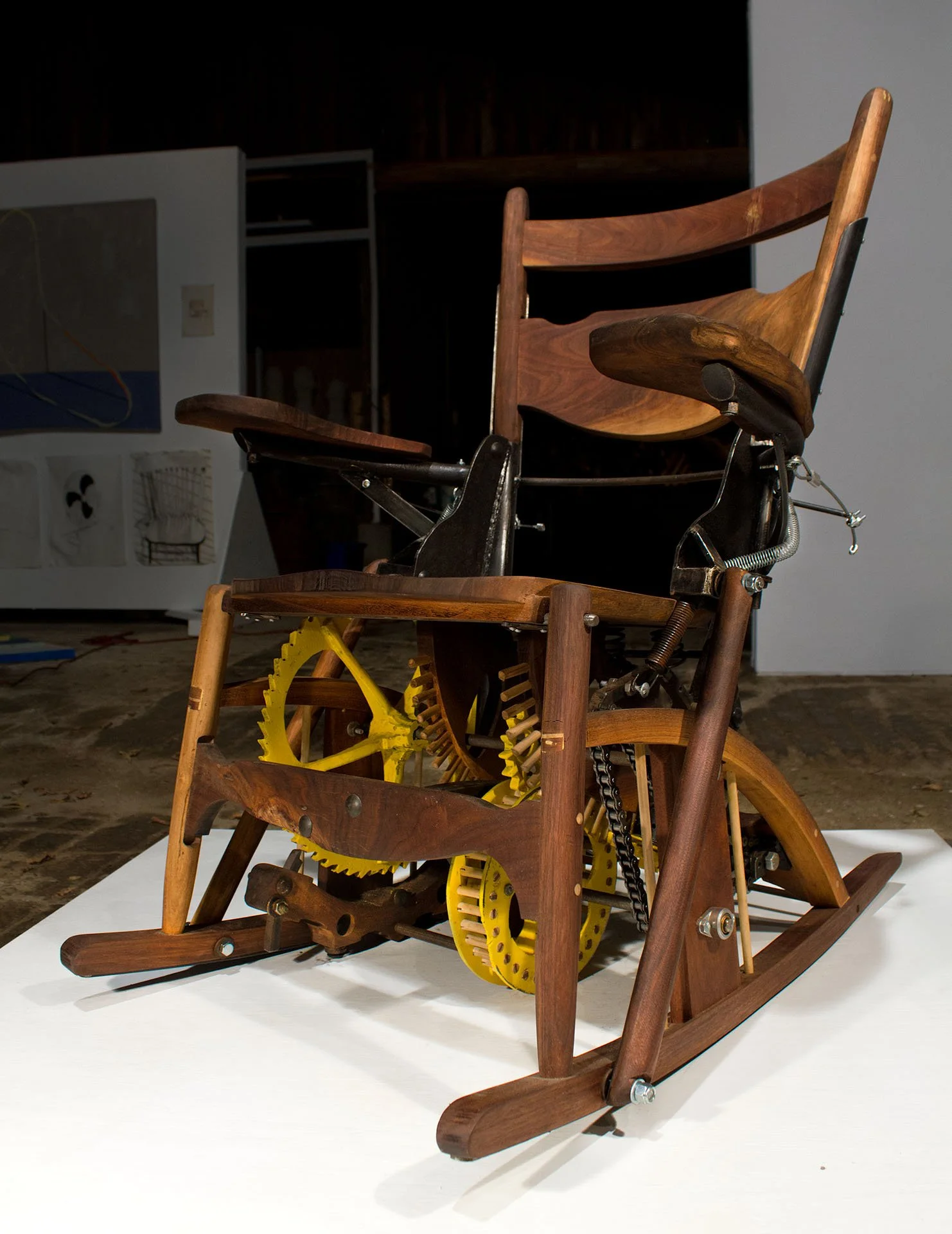 Clockwork rocking chair, in which user forms an integral part of the mechanism, discussing evolving relationships between technology and its user (2012)