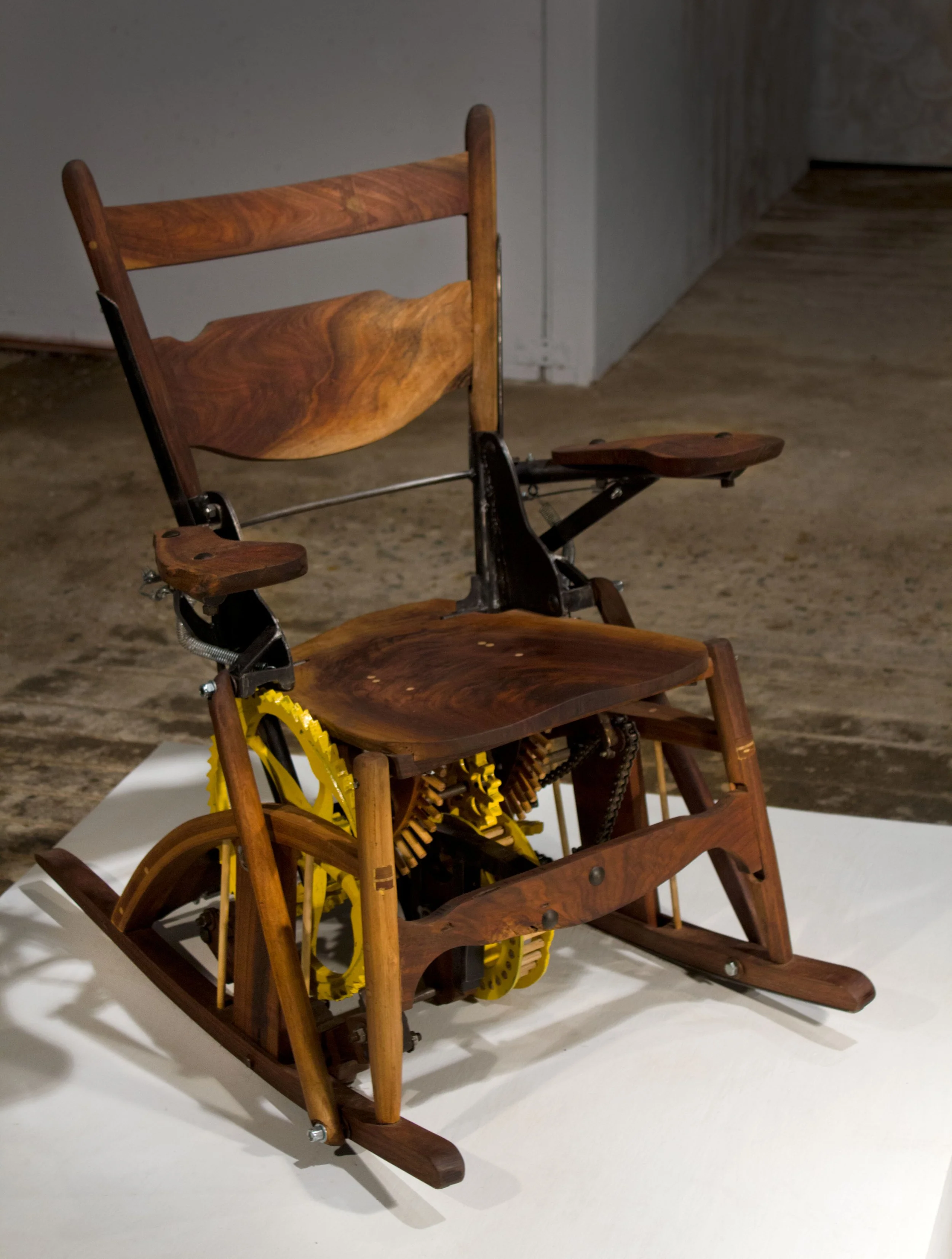 Clockwork rocking chair, in which user forms an integral part of the mechanism, discussing evolving relationships between technology and its user (2012)