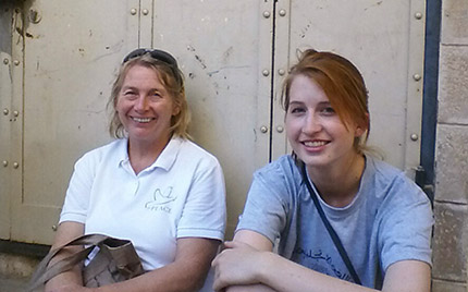 Camp co-director Margret and intern Kate take a seat in the Old City Market.