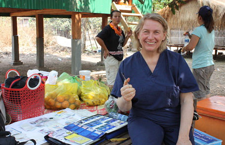 Margret Ellwanger manning the first-aid table.