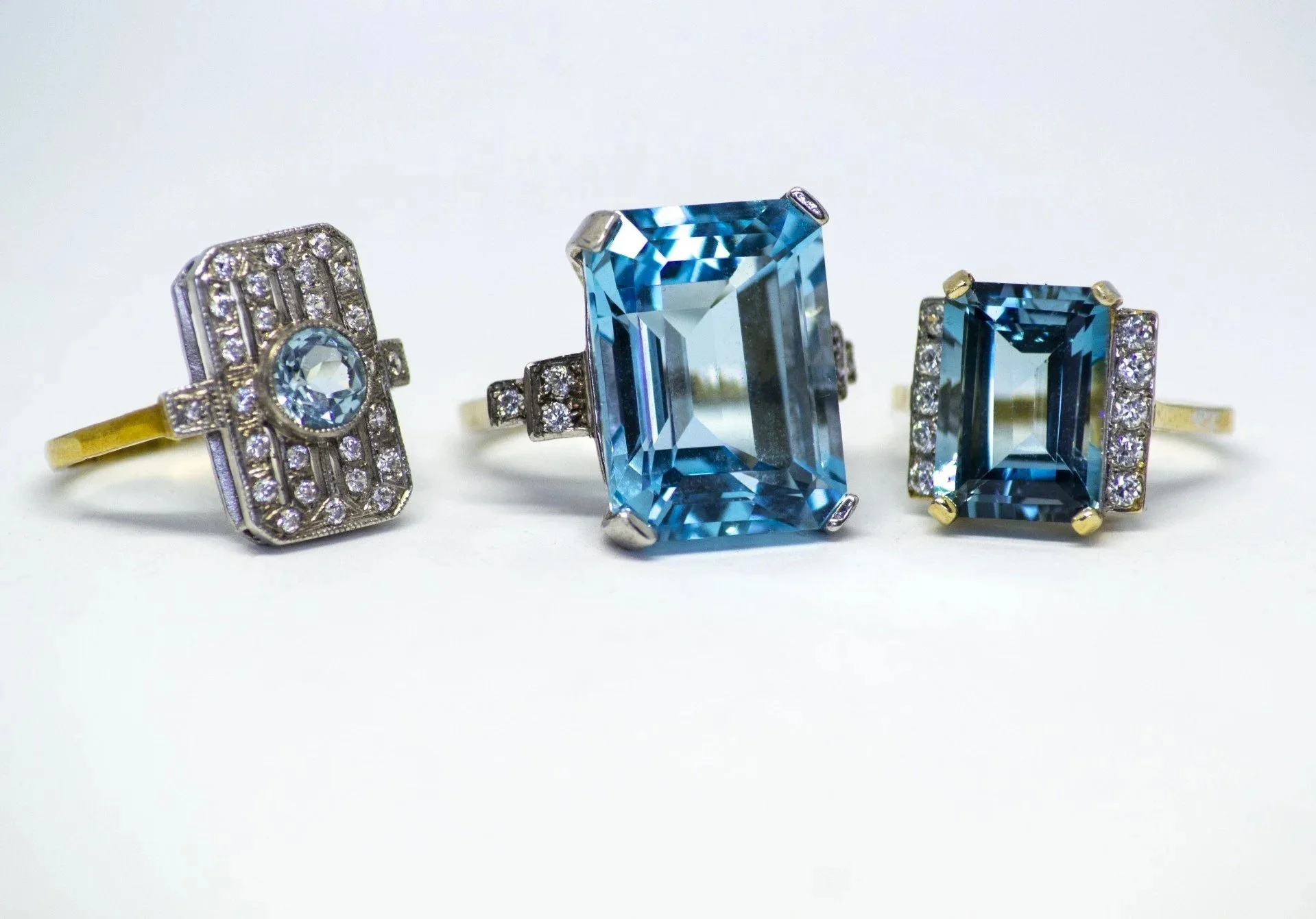 Selection of Art Deco themed Blue Topaz Rings