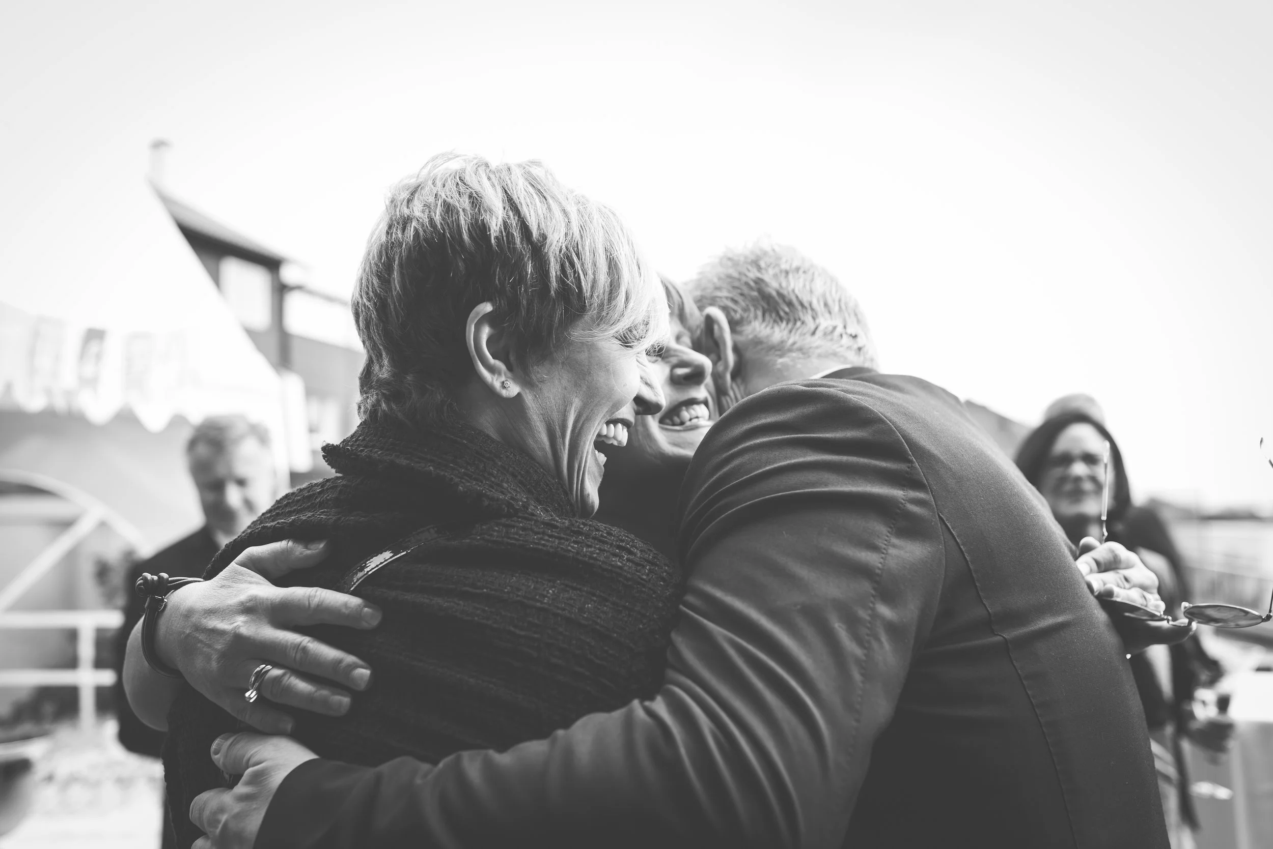 People hug at the wedding reception BW Stavanger Guillem Cheung Bryllup