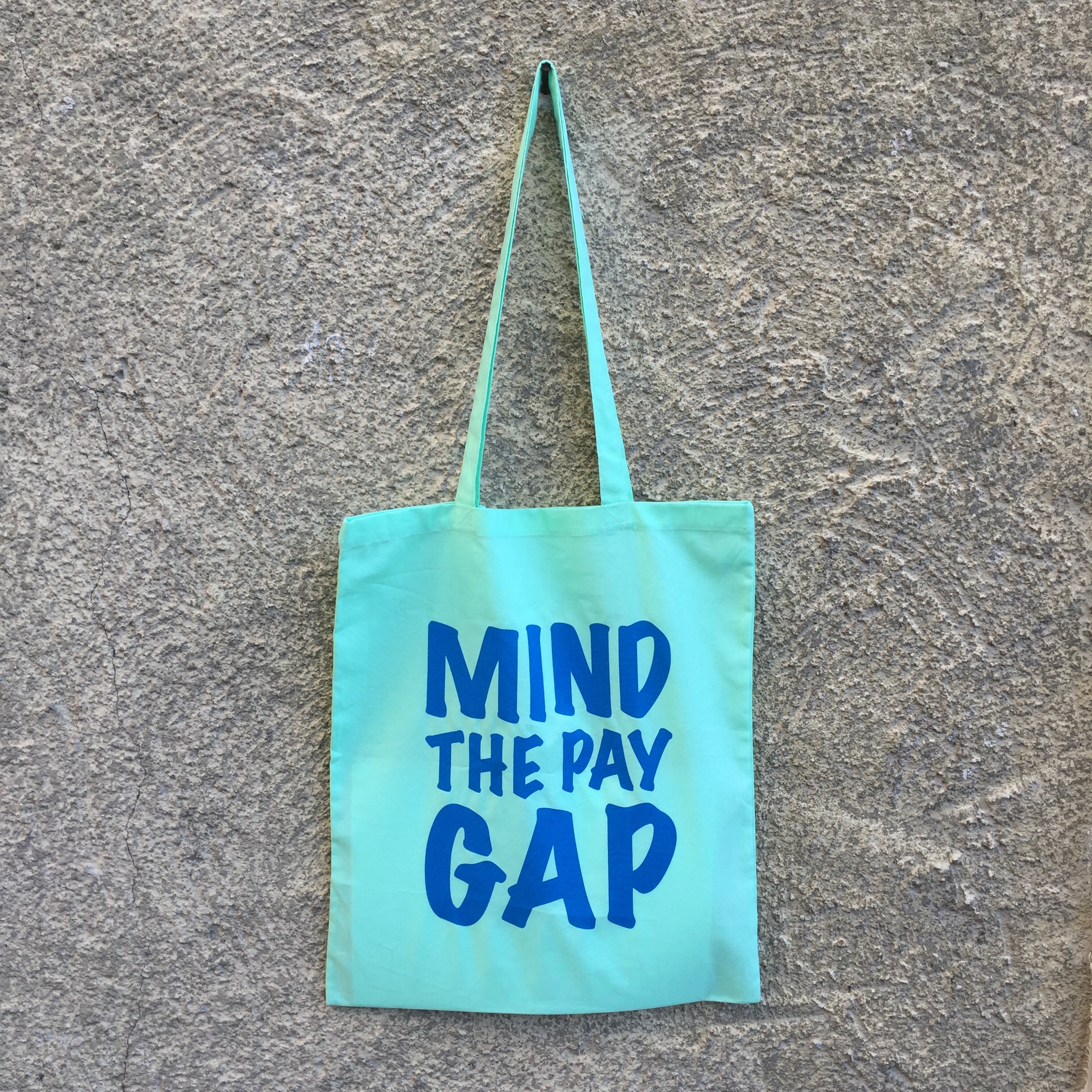 Mind the Pay Gap The gender pay gap reflects inequalities and discrimination in the labour market that mostly affect women. Women earn significantly less than men over their entire careers for complex, often interrelated reasons. These include: differences in caring responsibilities, more women in low skilled and low paid work, outright discrimination. At current rates of progress, it will take 62 years to close the gender pay gap. We are donating 25% = £2.25 of each sale to the Fawcett Society, the UK's leading charity campaigning for gender equality & women's rights.
