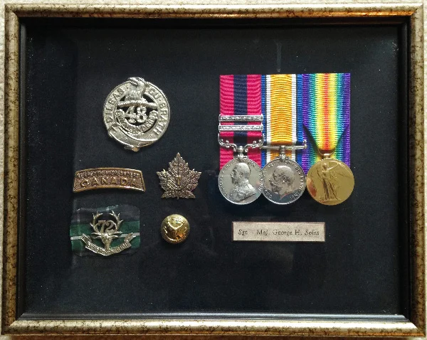CSM George H Soles' DCM with two bars is the left-most medal, with the blue and red ribbon.
