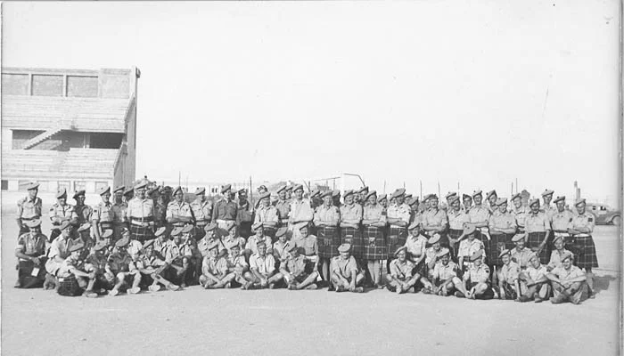 Officers, NCOs, and men of the Imperial Seaforth Highlanders and the Canadian Seaforth at Catania, Sicily.