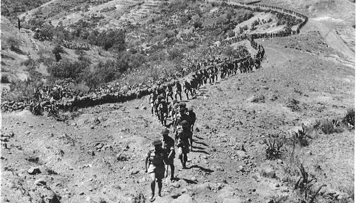 Seaforth Highlanders marching to meet General Bernard Montgomery, Commander 8th Army for a speech on 20 August 1943. Lt Col Bert Hoffmeister, the Commanding Officer is leading his Regiment.
