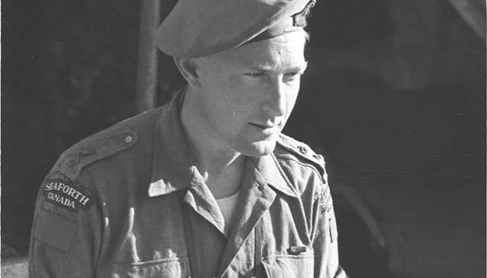 Lt Col Bert Hoffmeister poring over a map.