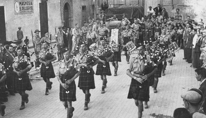  The Seaforth Pipes and Drums plays &lt;&lt;retreat&gt;&gt; in Agira's main square on the evening the town was captured. A CBC recording of the event was broadcast around the world. 