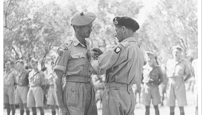 Major H.P. Bell-Irving receiving the Distinguished Service Order (DSO) from General Sir Bernard Montgomery, GOC 8th Army for his actions with A Company at "Grizzly Hill" near Agira. 
