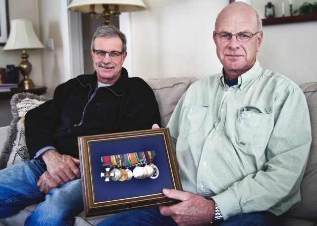 Patrick Vicars (left) and brother Tom showcase their fathers many military medals, including the Distinguished Service Order (left). The brothers will be at a memorial in Vimy Ridge this weekend to mark its 100th anniversary. Jessica Wallace/KTW