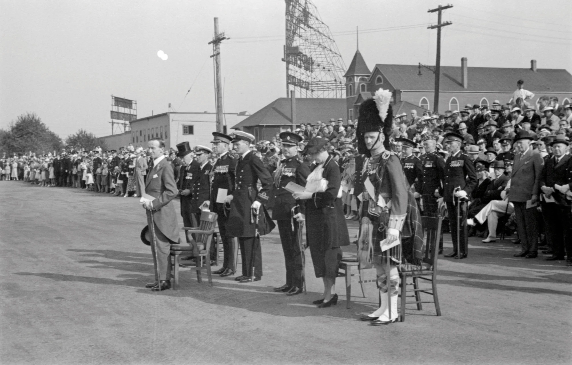 The Trooping of the Colour past the Governor General of Canada, Lord Tweedsmuir. To the right of the royal standard is Captain C.C.I. Merritt, who would later be awarded the Victoria Cross while commanding the South Saskatchewan Regiment at Dieppe. To the left of the royal standard is Captain J.M.S. Tait, who would later serve briefly as Commanding Officer of the Seaforths in 1942.