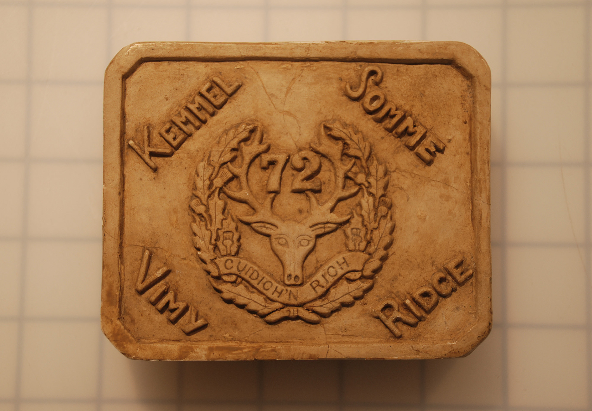 Corporal Rico Christie Cao carved this image, showing the Seaforth’s crest and major battles, from a piece of the chalk walls of Vimy.