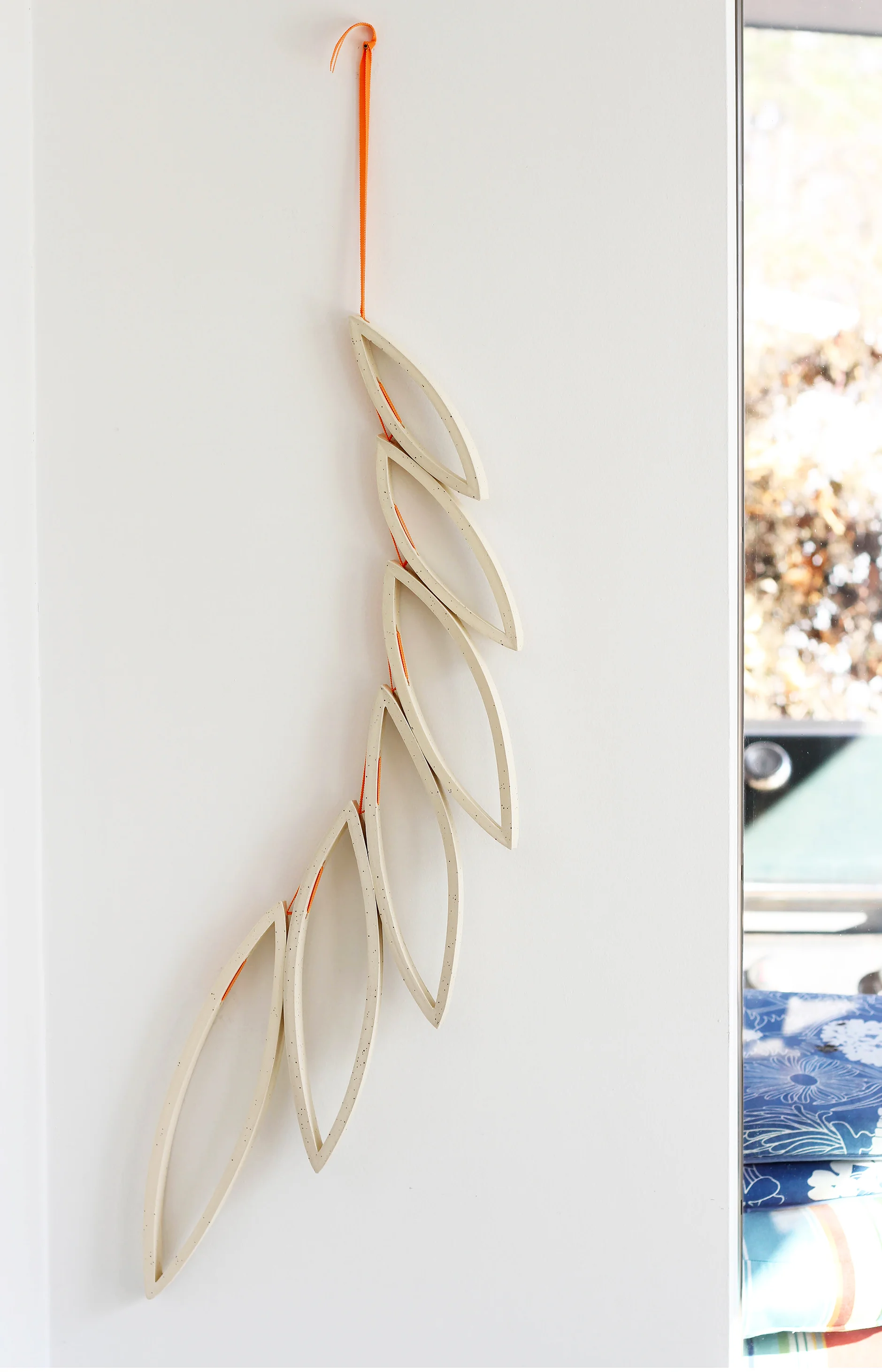 Helen Prior Large Inverted leaf fan speckled clay with orange ribbon 2.jpg