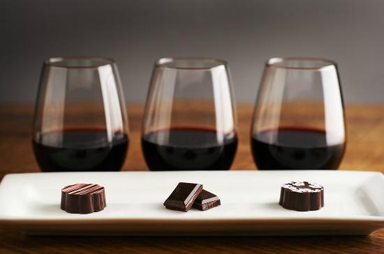White chocolate : Match with Sherry, Muscat , a fruity Chardonnay, or a Moscato d'Asti. These wines will pick up on the buttery, fatty tones of what isn't always considered to be a "real" chocolate. For those who don't mind a risk, a contrasting wine heavy in tannins might just work to cut through the fattiness of white chocolate. Milk chocolate : Try Merlot, Pinot Noir, Riesling, Muscat, and dessert wines. Champagne is also a natural match for milk chocolate. The crisp, dry flavour of the bubbly contrasts perfectly with the creaminess of a simple milk chocolate tablet. Be careful of the higher sugar levels in milk chocolate, as these may cancel out any fruitiness in dry red wines, leaving them tasting bitter. Dark chocolate (50% to 70%) : Pair this with more robust wines, such as Cabernet Sauvignon, Zinfandel, Pinot Noir , and Port. A Chianti can match well with chocolate around 65 percent cocoa content. Bittersweet chocolate (70% to 100%) : This chocolate type enters the bitter range with deep intensity. Chocolate gourmands adore this range of taste, so the wine should live up to it. Good choices include Bordeaux, Beaujolais, Shiraz, Orange Muscat, Port, Malbec, and Zinfandel. Try champagne or sparkling wine with all chocolate types. It is a variety that compliments many flavors. Many fortified dessert wines work well across the chocolate spectrum as well. Β http://www.wikihow.com/Pair-Wine-and-Chocolate
