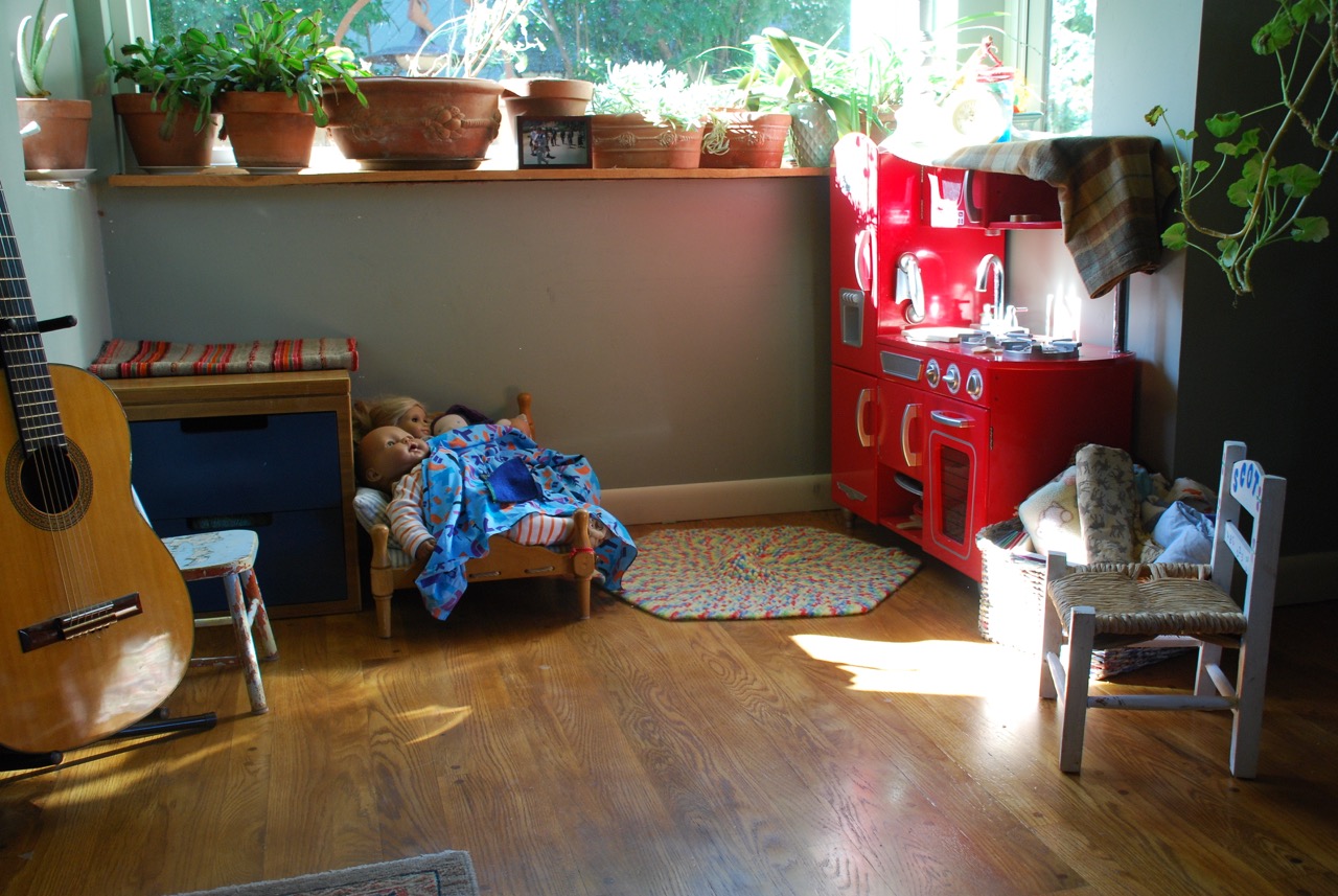 A kid's nook with sunshine and plants. 
