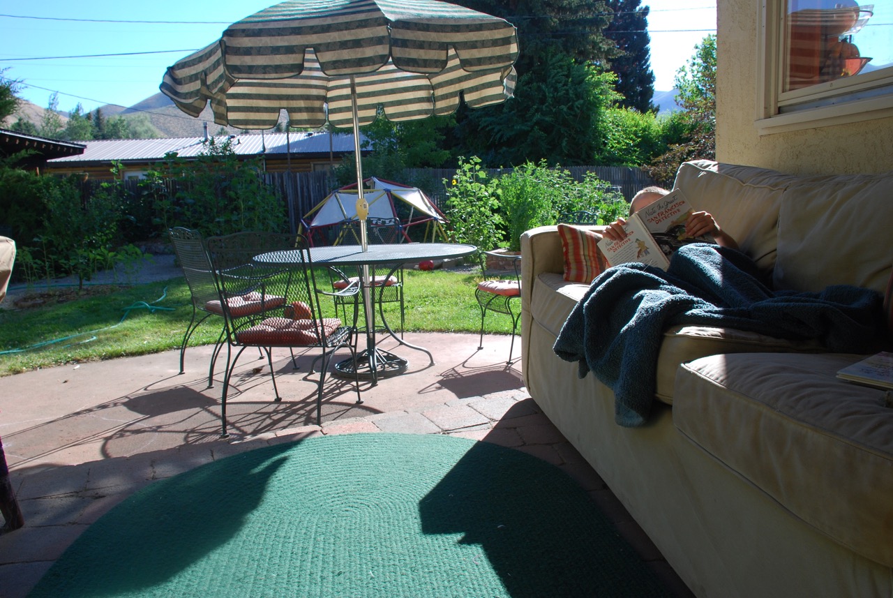The quintessential summer day, relaxing with a good book in our newly formed outdoor living space