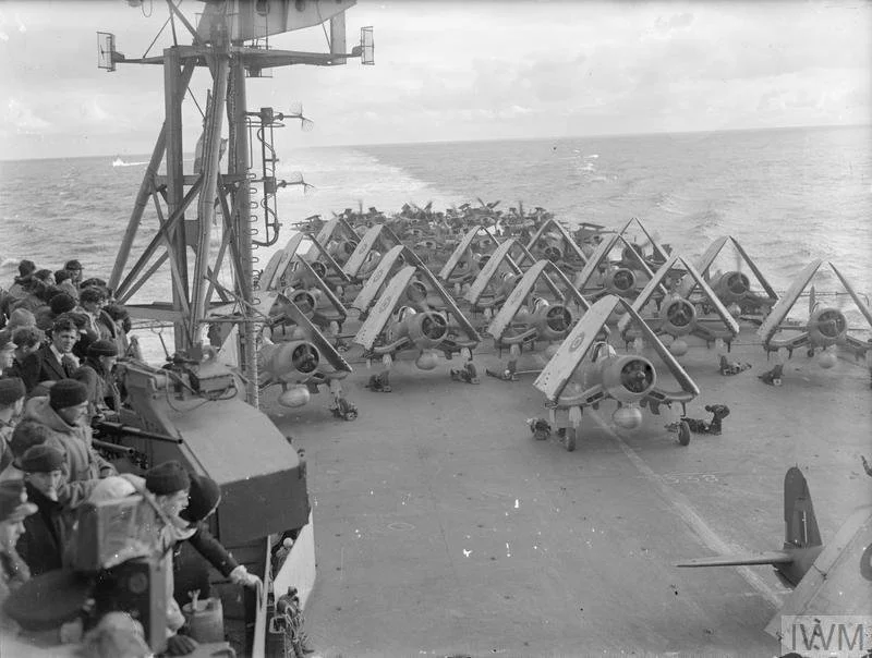 Barracuda and Corsair aircraft are ranged across HMS Formidable’s flight deck as the carrier prepares to launch strike operations. Source: Imperial War Museums (IWM A 25441).