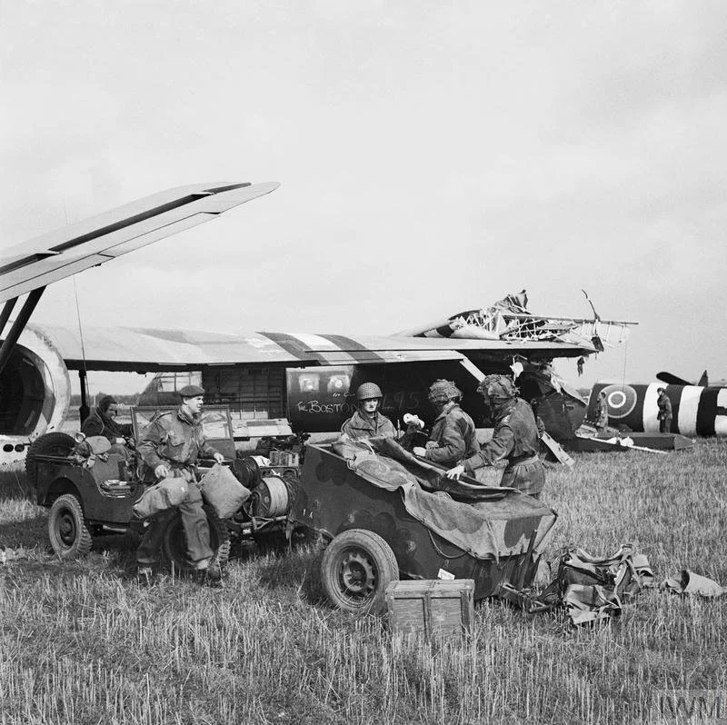 IWM BU 1164: HQ of 1st Airlanding Light Regiment, Royal Artillery, unload a jeep and trailer from their Horsa glider at the landing zone near Wolfheze in Holland, 17 September 1944.