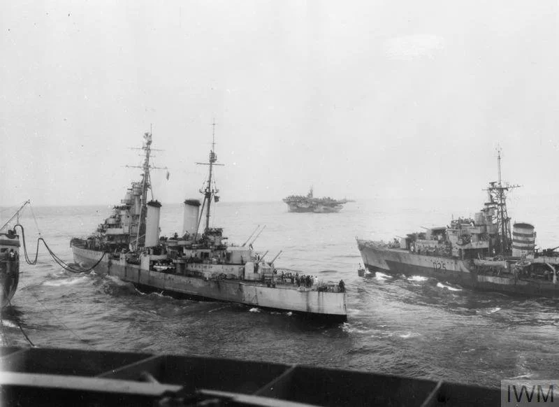 HMS Formidable and HMS Euryalus refuel from a British Pacific Fleet tanker, while Euryalus simultaneously transfers stores to the destroyer HMS Undaunted. Source: Imperial War Museums (IWM A 30072).
