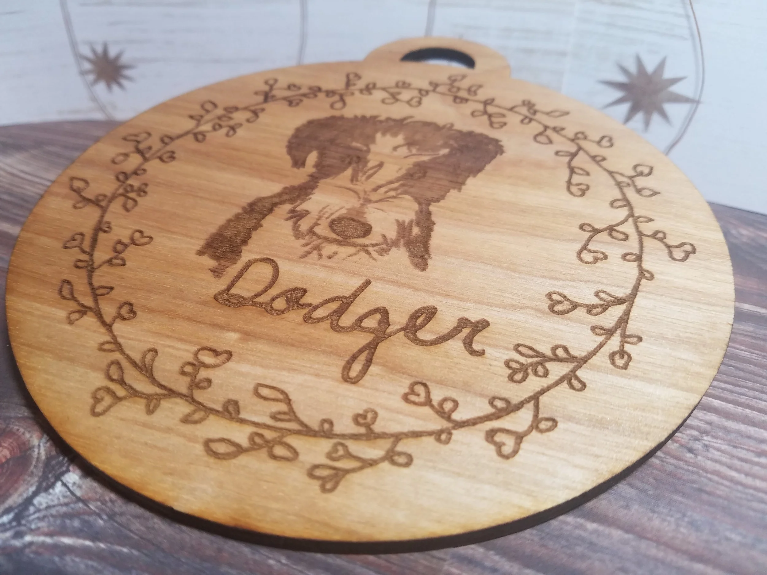 Hand drawn sketch Laser etched on a wooden ornament as a Memorial of the best dog ever.