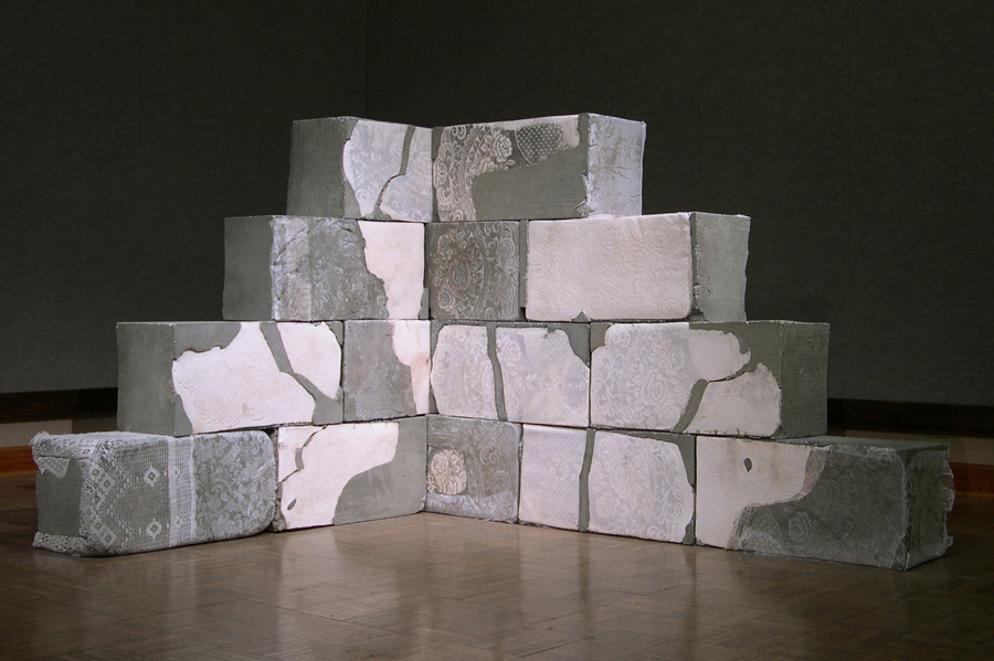   Cornered , 2010 Cast cement, porcelain and lace, 48x65x12 inches 