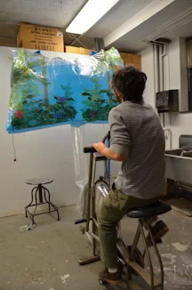 student inflating project using exercise bike