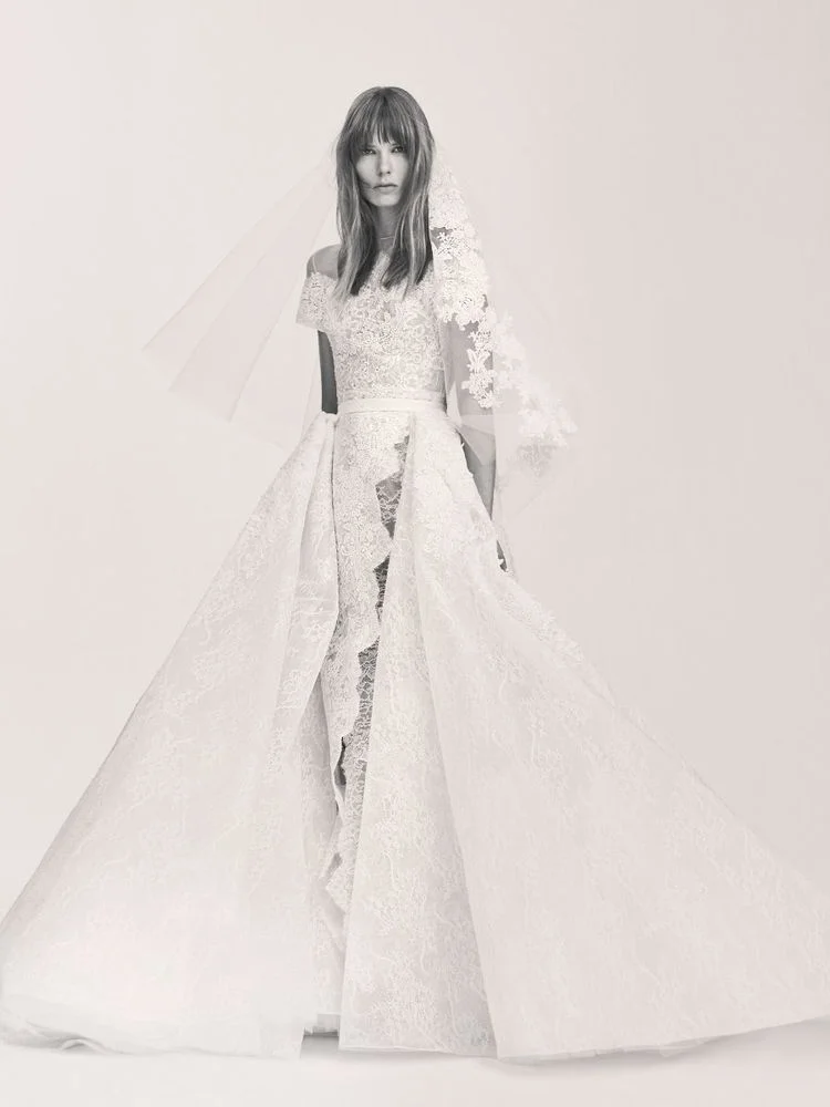 THE DRESS : Remove the overskirt from this show-stopping Elie Saab classic and the fantastically formal gown becomes emphatically casual; embroidered guipure lace adds to the charm factor. (PHOTO: Courtesy of Elie Saab)