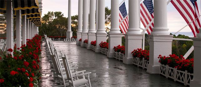 THE GATHERING SPOT : Even more of an island landmark than British-built Ft. Mackinac, the utterly civilized Grand Hotel boasts the world’s longest front porch, a popular ceremony spot with views of the manicured gardens and waterfront. (PHOTO: Courtesy of Grand Hotel)