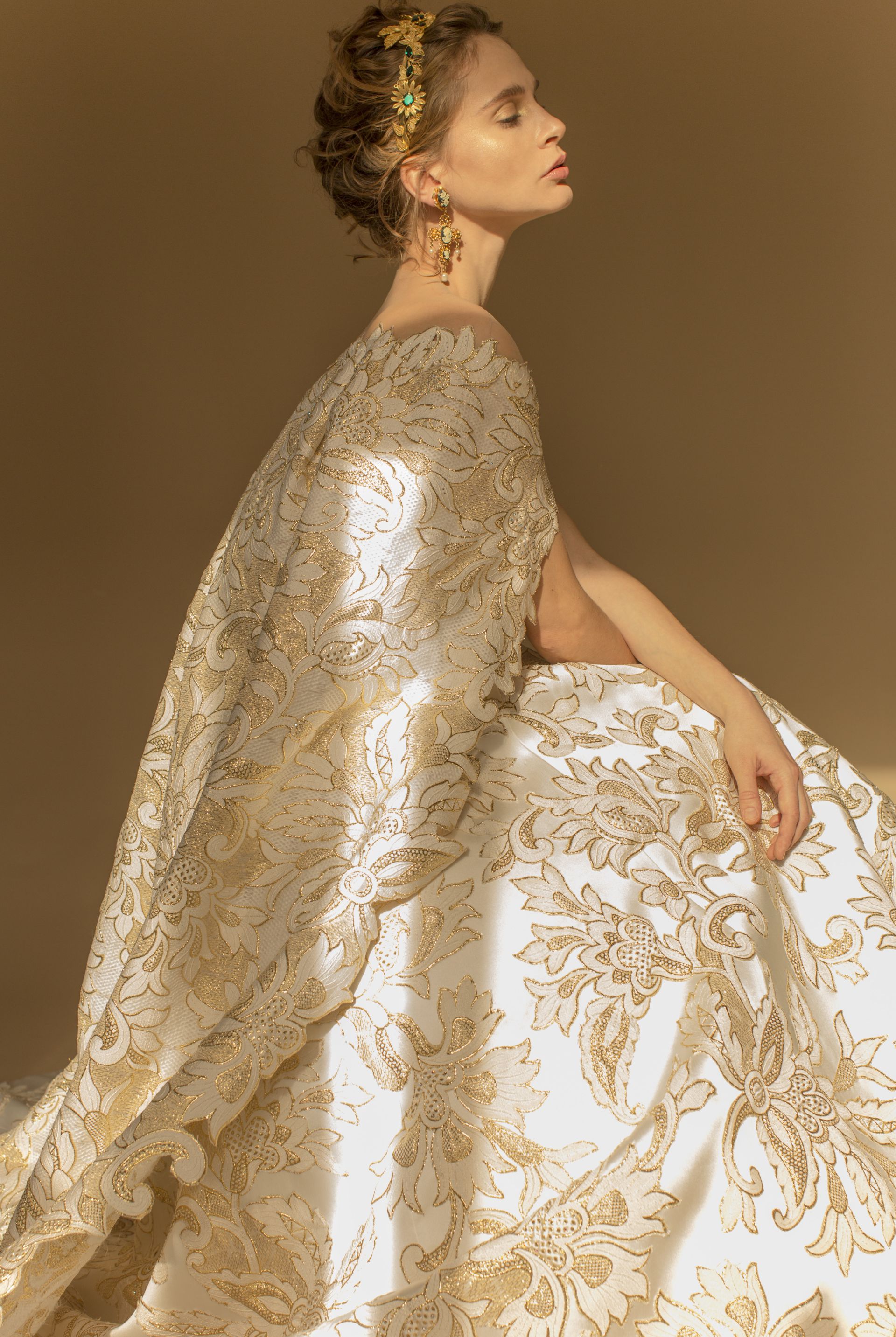 Even the best-dressed czarina would have a hard time competing with this jacquard fantasy embellished with metallic gold threads and Swarovski pearls.
