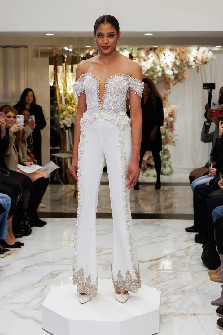 Party pants and jumpsuits are in for the Spring 2025 NYLBFW! A spectacular off-the-shoulder @eseazenabor jumpsuit with crepe pant legs and pearl and crystal trim detailings.

#luxurybridal #bridal #SS2025 #Spring2025 #Bridal2025 #trend #trendaleart #
